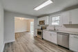 coastal driftwood dark grey luxury vinyl plank flooring in the kitchen