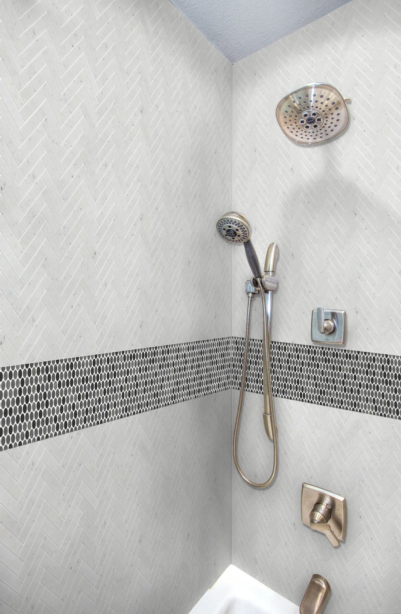 White Carrara Honed 1" X 4" Herringbone shower tiles